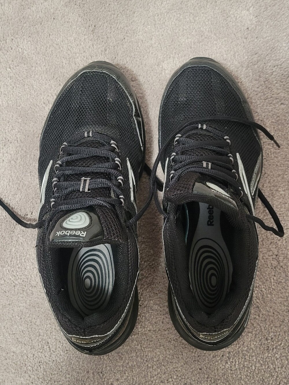 Reebok Womens Black Athletic Running Shoes with White Accents.